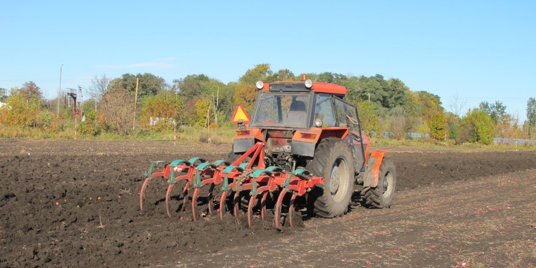 Tractor with subsoiler performing tillage