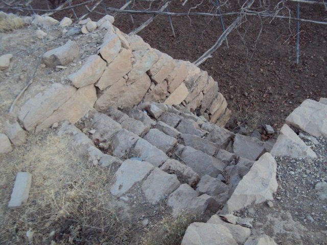 Building Walls's stones to protect lands and building outlet to drain excess water