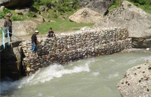 Strengthening of river banks with stones and gabions