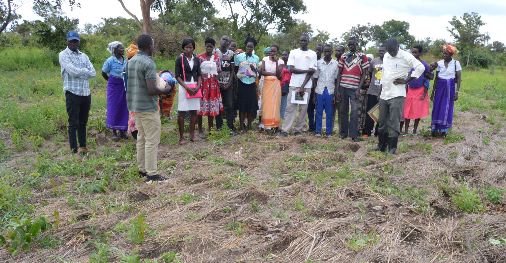 Extension agents and farmers during farmer to farner  exchange visit  to Conservation farming host farmer